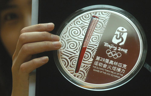 Olympic torch relay badge hits market