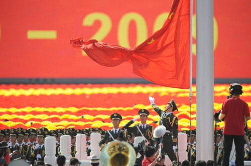 Sixty-gun salutes, flag raising ceremony kick off grand celebration