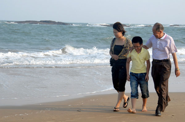 Couples tie knot across Straits