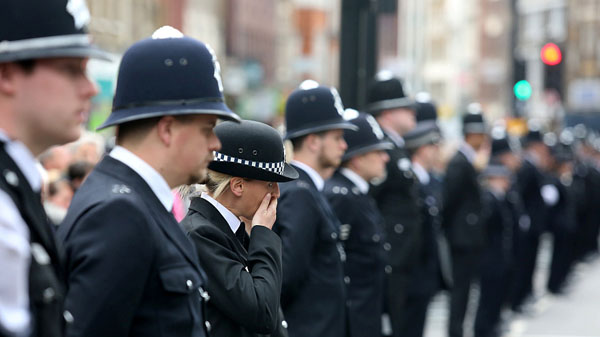 Thousands of UK police pay respects to officer killed in attack