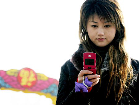 A girl uses her mobile phone