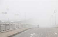 Beijing issues alert as smog smothers N China