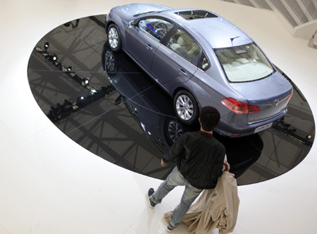 A man stands next to a Brillian Auto's FSV