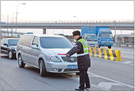 Beijing's new traffic rules surprise some drivers