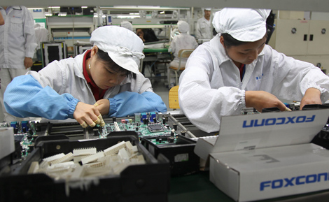 Foxconn vows to reduce hours at factories