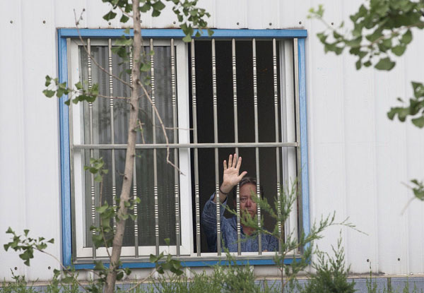 US factory boss held hostage in Beijing