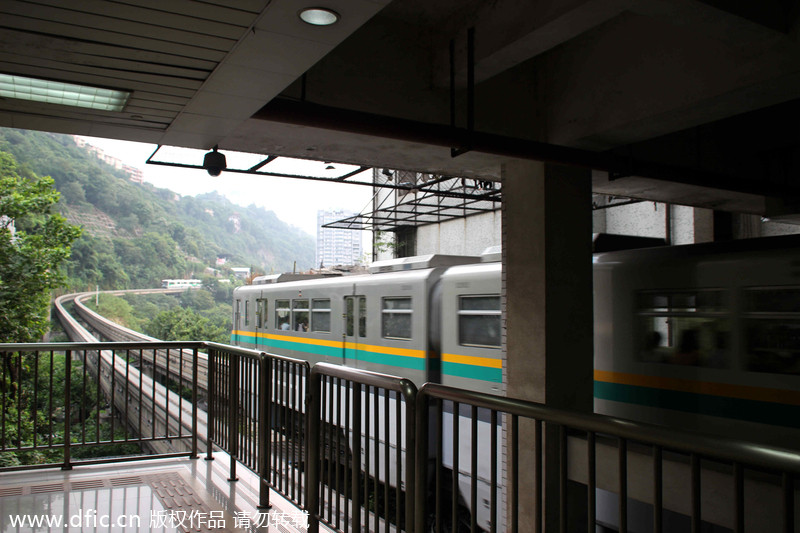 Light rail pass through building in Chongqing