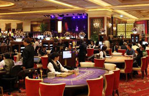 Macao gambling revenues tumble 23%