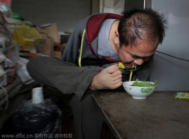 Armless young man runs his own store