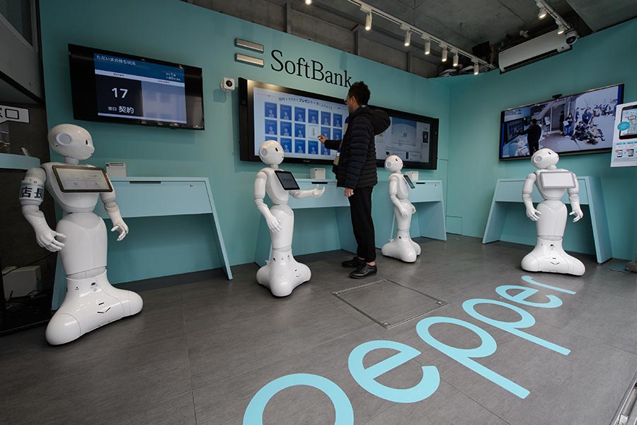 SoftBank staffs cell phone store with Pepper robots