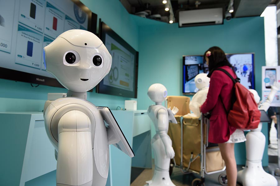 SoftBank staffs cell phone store with Pepper robots