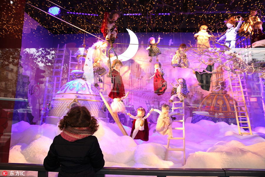 Stores decorate windows for upcoming Christmas shopping season