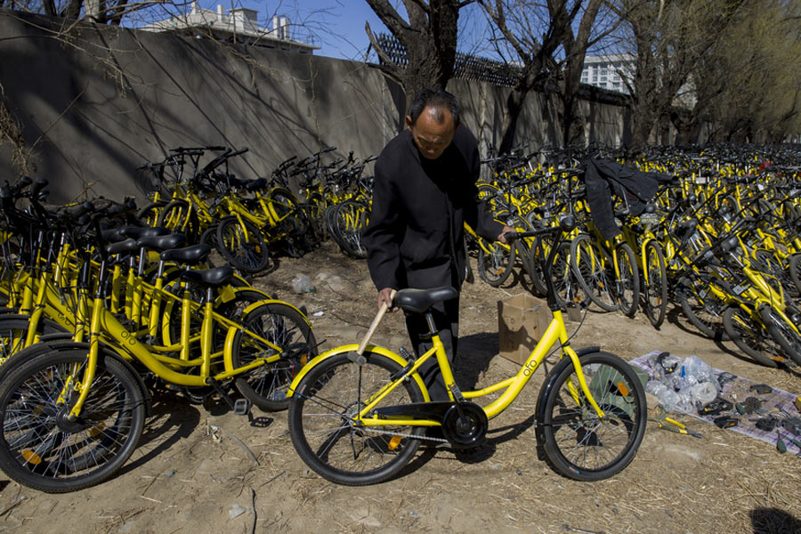 Repairmen race to get shared bikes back on the streets
