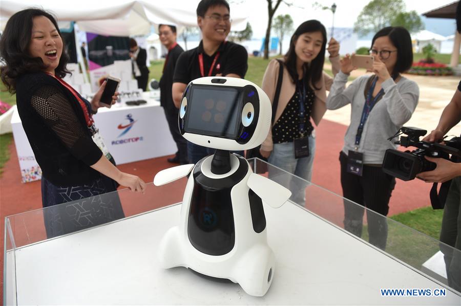 Hugging, calligraphy writing robots featured in Yuyao