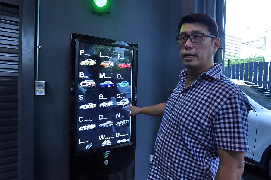 Singapore dealership sells luxury cars in 15-floor vending machine
