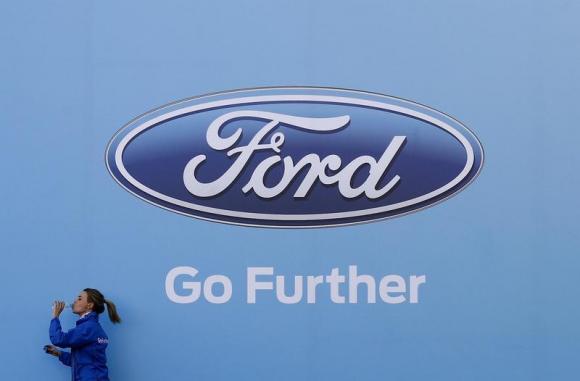 Ford says profit to slow a gear in '14; shares slump