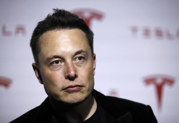 Tesla gives strong 2014 outlook, shares jump 12%