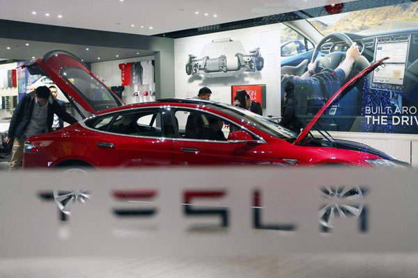 Wait ends for eight as Tesla delivers Model S