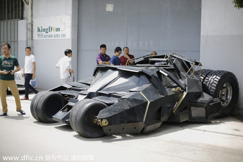 Batman fan opens door to his Batmobile