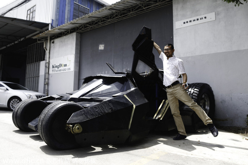 Batman fan opens door to his Batmobile