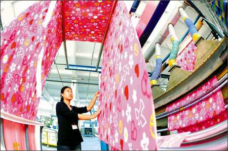 China to raise tax rebate for garment, textile exports