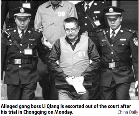 Alleged gang boss denies bribing officials