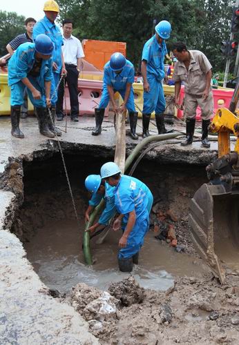 Pavement collapses in heavy rains