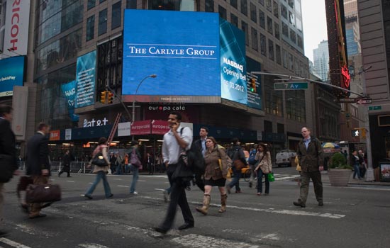 Carlyle buys stake in health checkup firm
