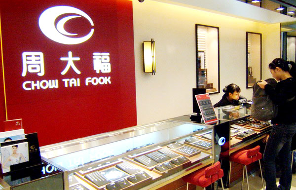 Chow Tai Fook plunges 5.6% on profit warning