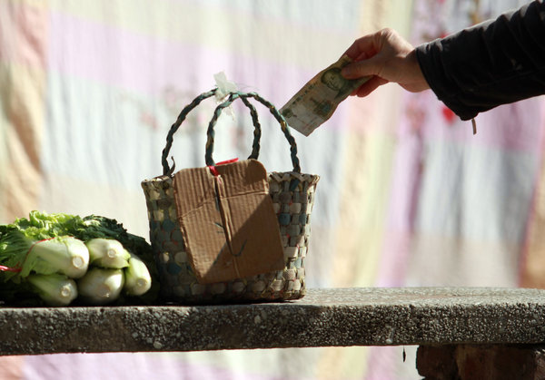 Self-service vegetable and newspaper stands in China