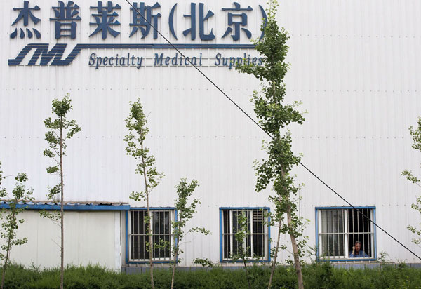Chip Starnes, co-owner of Specialty Medical Supplies, looks out a window at the company's plant on the outskirts of Beijing, where he says he's been “kidnapped” by workers over a labor dispute, June 24, 2013. US factory boss held hostage in Beijing