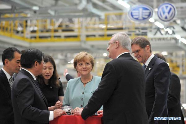 Factory's energy efforts thrill German leader