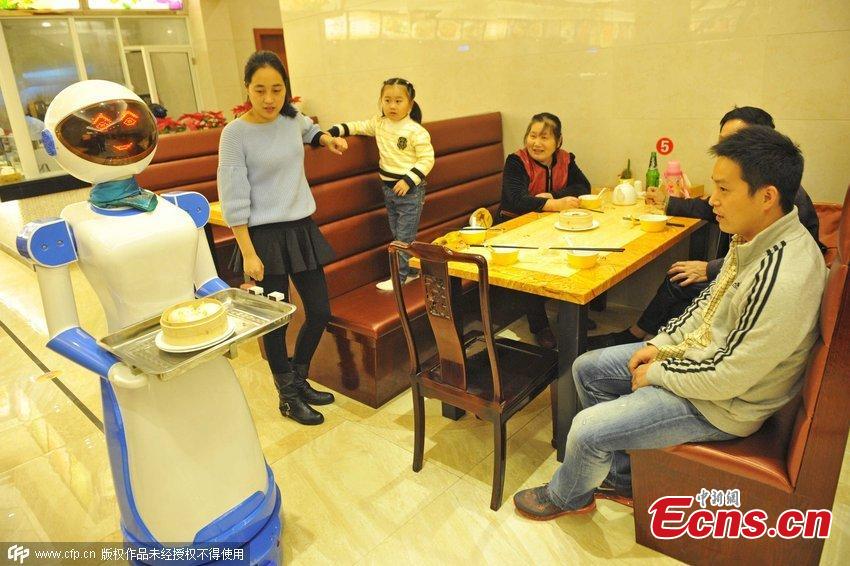 Robot waiters serve in Ningbo restaurant