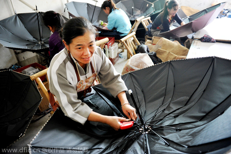 Women make umbrellas for export in Jiangxi