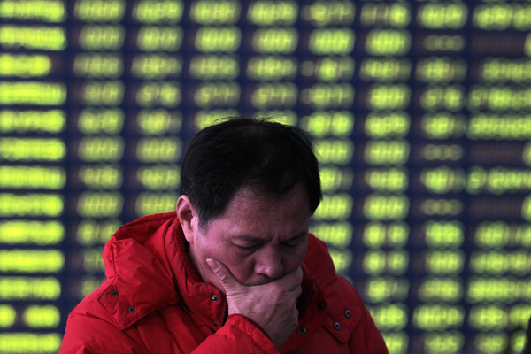 Chinese stocks edge down after bank reserve requirement cut