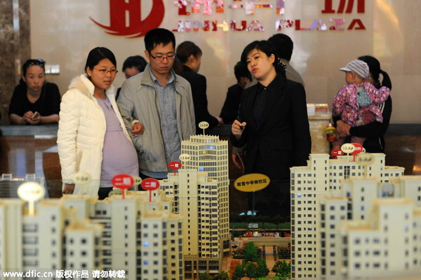 China's home price decline slows in March: surveys