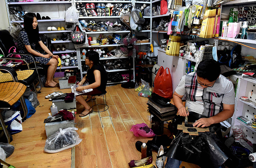 Couple with disabilities thrive in a shoe repair shop