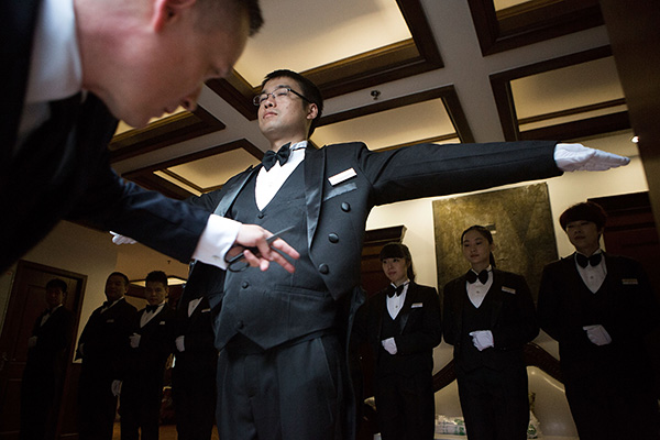 Learning skills of a Western-style butler to serve the super rich