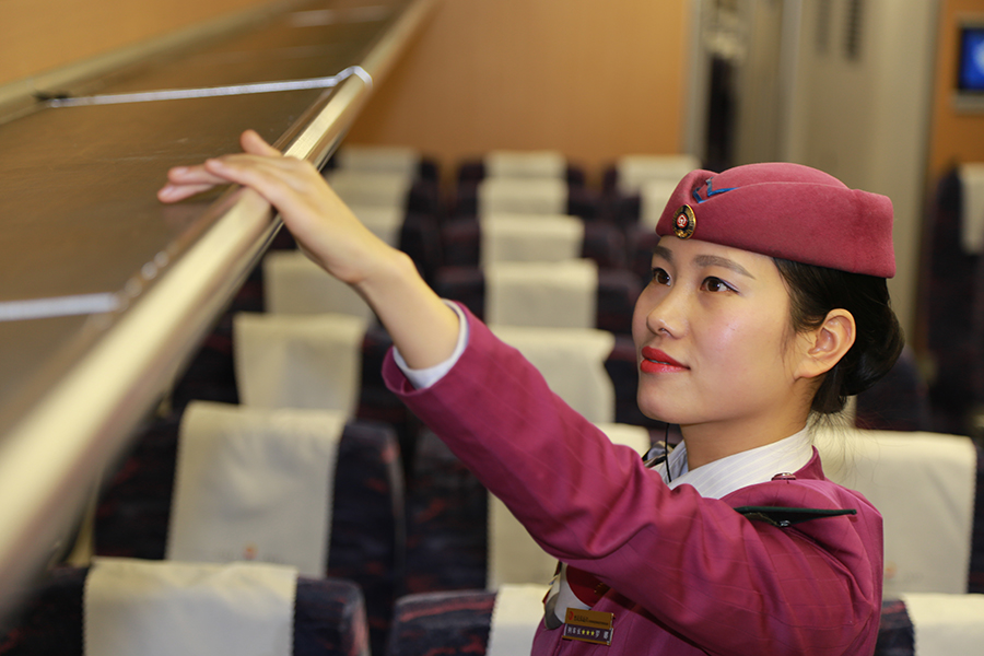 Attendants work in a standby bullet train