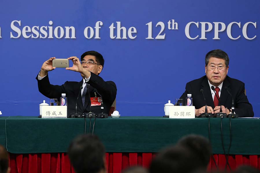 Sinopec's ex-chairman with his Huawei smartphone