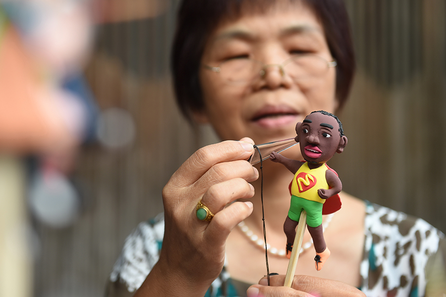 Dough figurine artists create mini Olympic stars