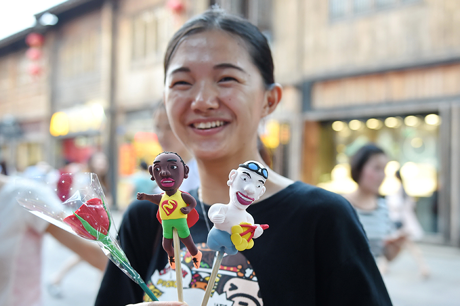 Dough figurine artists create mini Olympic stars