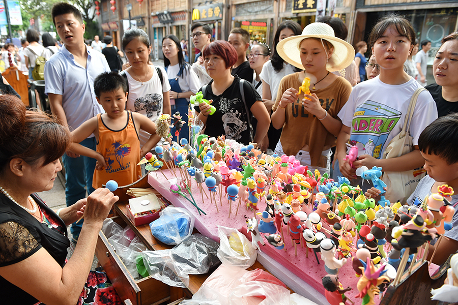 Dough figurine artists create mini Olympic stars