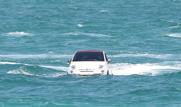 Fiat cars swimming off coast
