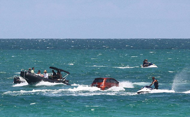 Fiat cars swimming off coast