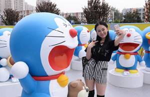 Cars with colorful cartoon drawings parade in Hangzhou