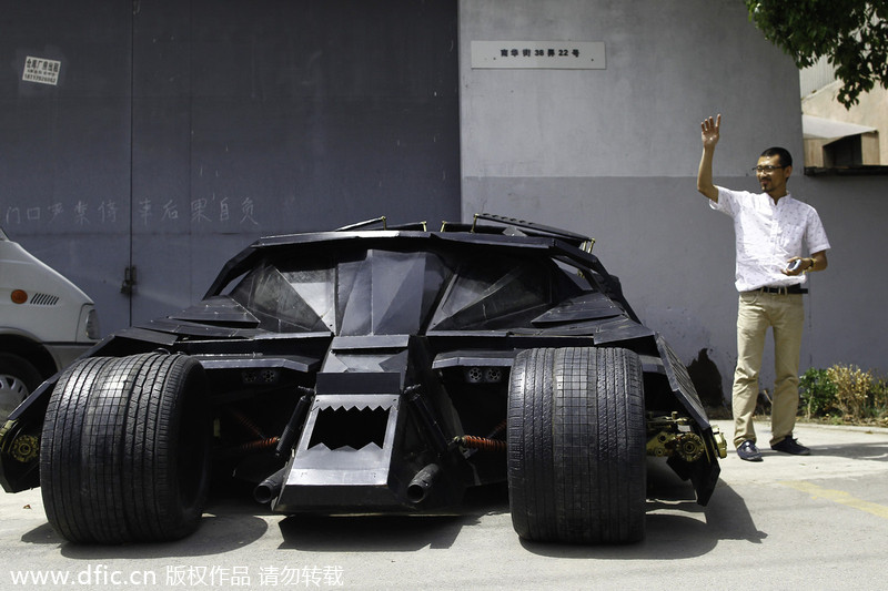 Batman fan opens door to his Batmobile