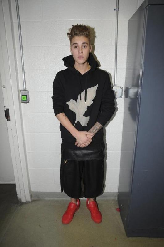 Handout shows Justin Bieber in police custody