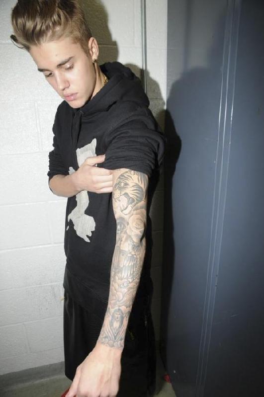 Handout shows Justin Bieber in police custody