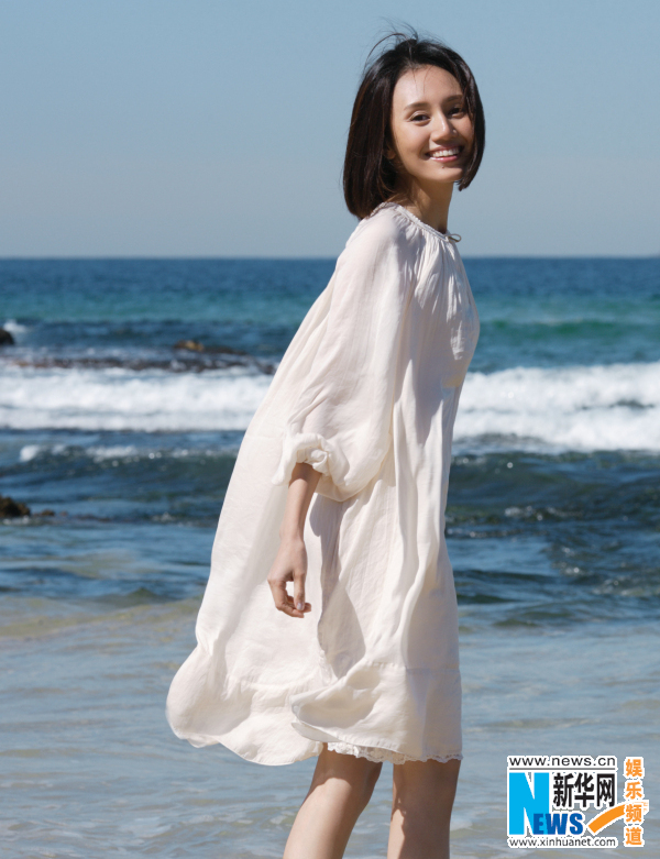 Actress Yuan Quan poses on beach